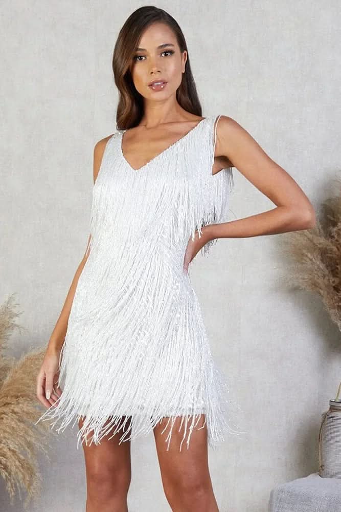 Close-up of a women's A-line fringe dress, showing shimmering sequin details & texture.