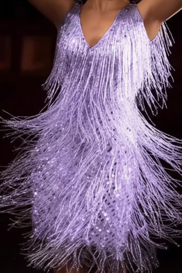 Chic women's A-line evening dress with shimmering fabric & playful fringe, suitable for any party.