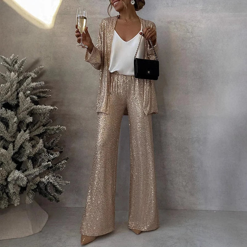 Glamorous women's two-piece sequin set for special occasions, featuring a sparkling top & high-waisted pants.