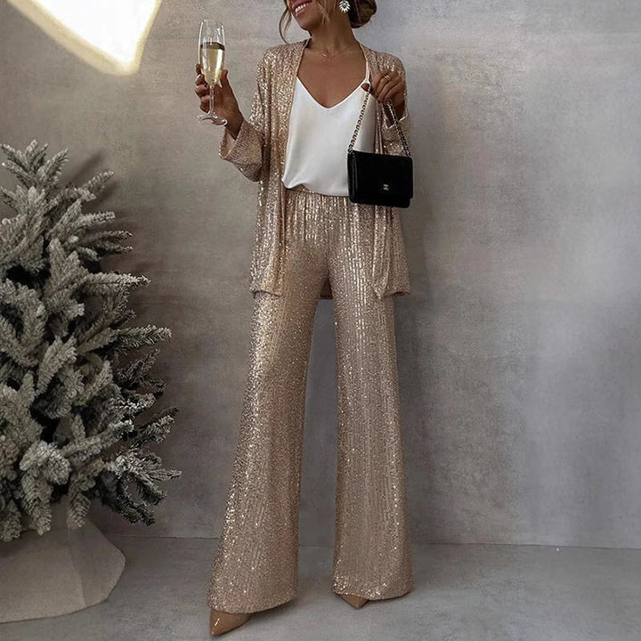 Glamorous women's two-piece sequin set for special occasions, featuring a sparkling top & high-waisted pants.