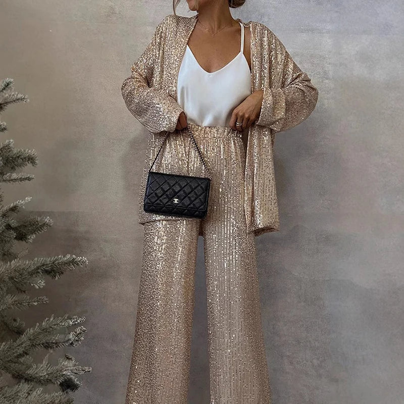 Fashionable women's sequin top and high-waisted pants set, a chic and shimmering outfit for evening events.