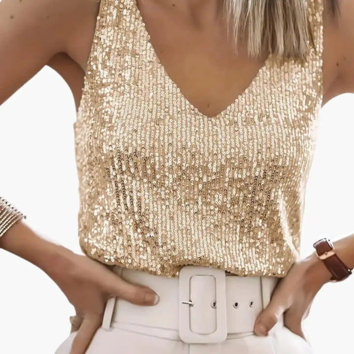 Get party ready with this shimmering women's sequin tank top. Round neck, sleeveless, casual glam.