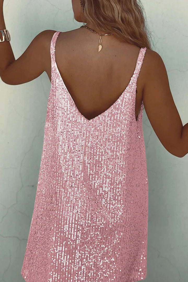 Shimmering sequin V-neck mini dress. Women's elegant party attire for dazzling cocktail nights & holidays.