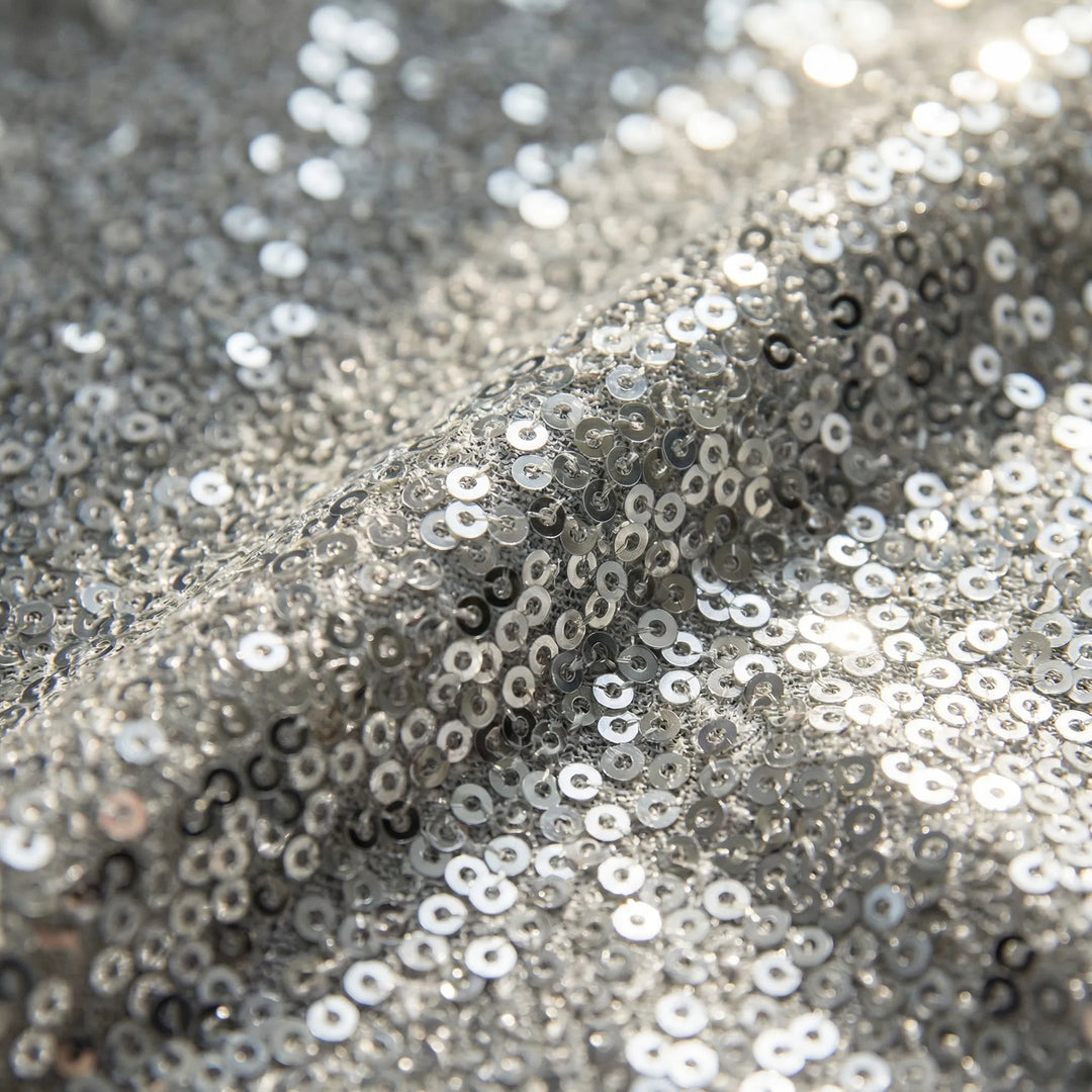 Versatile shimmering V-neck long-sleeve blouse for women. Elegant top, great for parties, evening, or smart casual.