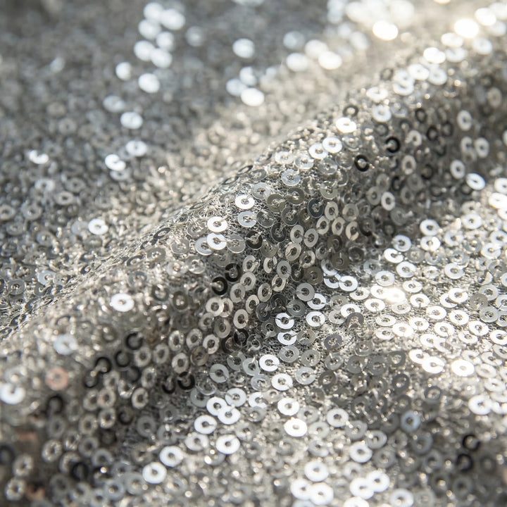 Versatile shimmering V-neck long-sleeve blouse for women. Elegant top, great for parties, evening, or smart casual.