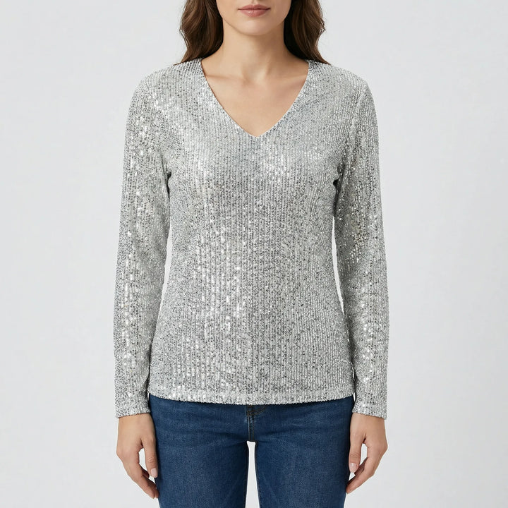 Women's shimmering long-sleeve V-neck blouse, an elegant and versatile top for dressy or casual chic outfits.