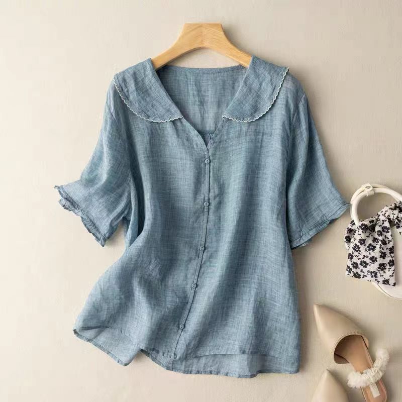 Elegant women's short sleeve button-front top with delicate scalloped edge collar, a versatile piece for any season.