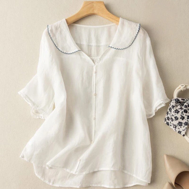 Comfortable women's short sleeve summer blouse, designed with a chic button front and a pretty scalloped collar.