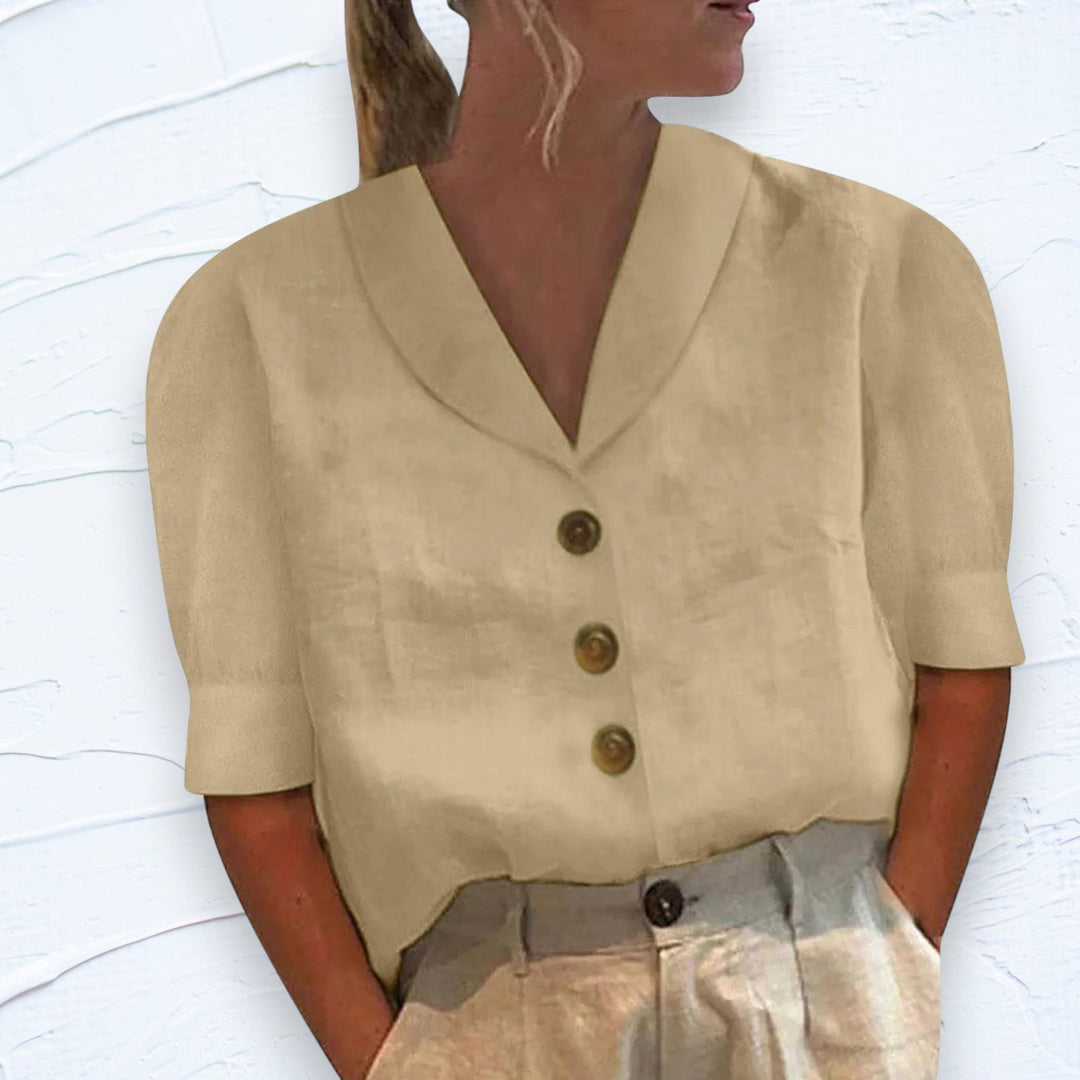 Stylish women's short sleeve top featuring a classic button-up front. Perfect for versatile summer and spring outfits.