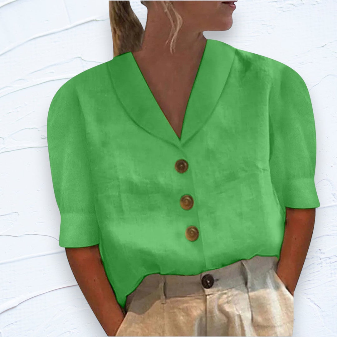 Relaxed fit women's short sleeve top with button-front detail. A comfortable and chic everyday fashion staple.