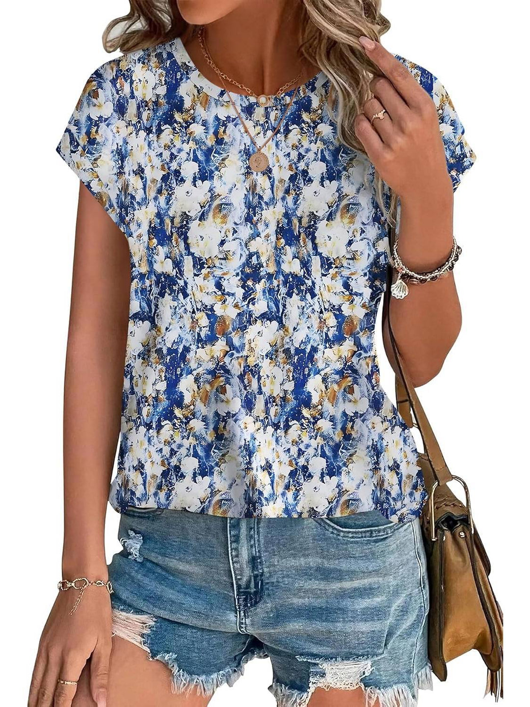Stylish women's casual shirt with vibrant watercolor leaf print. Short sleeve, crew neck.