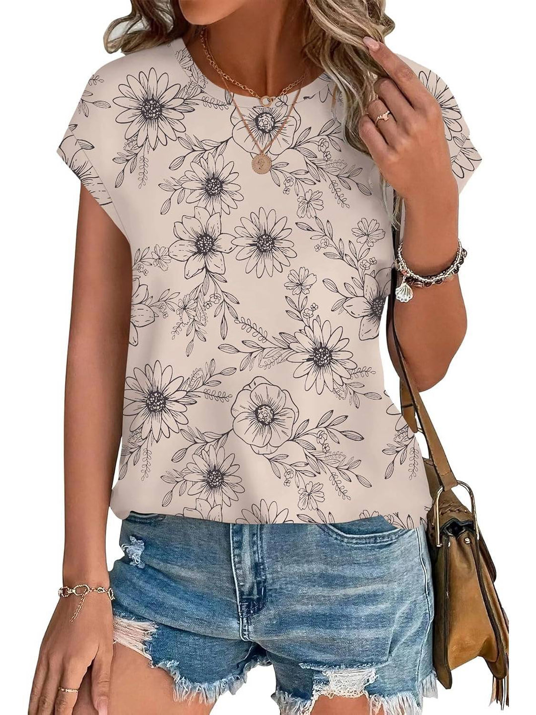 Green leaf print women's crew neck top. Soft, casual short sleeve shirt for spring and summer.