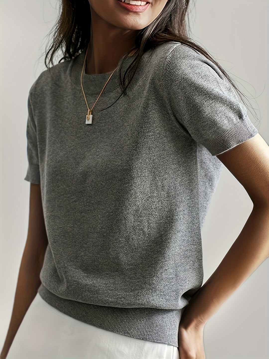 Women's short sleeve crew neck tee with ribbed hem. Casual everyday top.