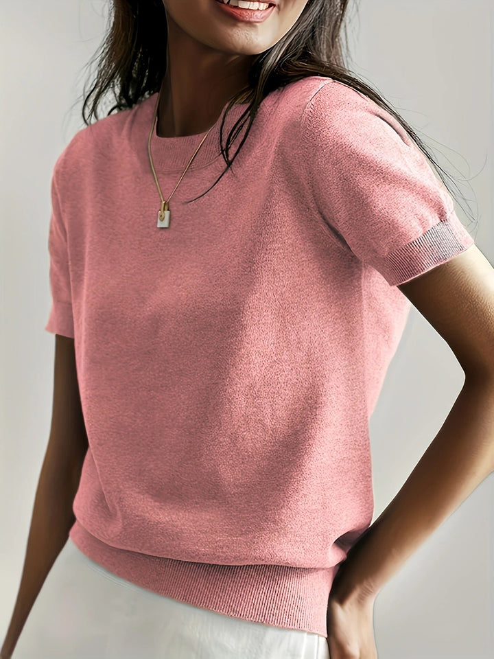 Chic women's short sleeve crew neck top with a flattering ribbed hem.