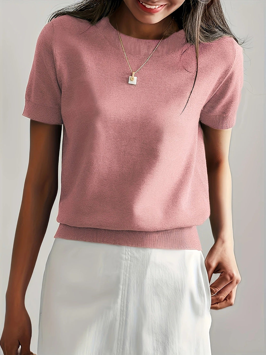 Simple yet stylish women's crew neck tee. Short sleeve and ribbed hem.