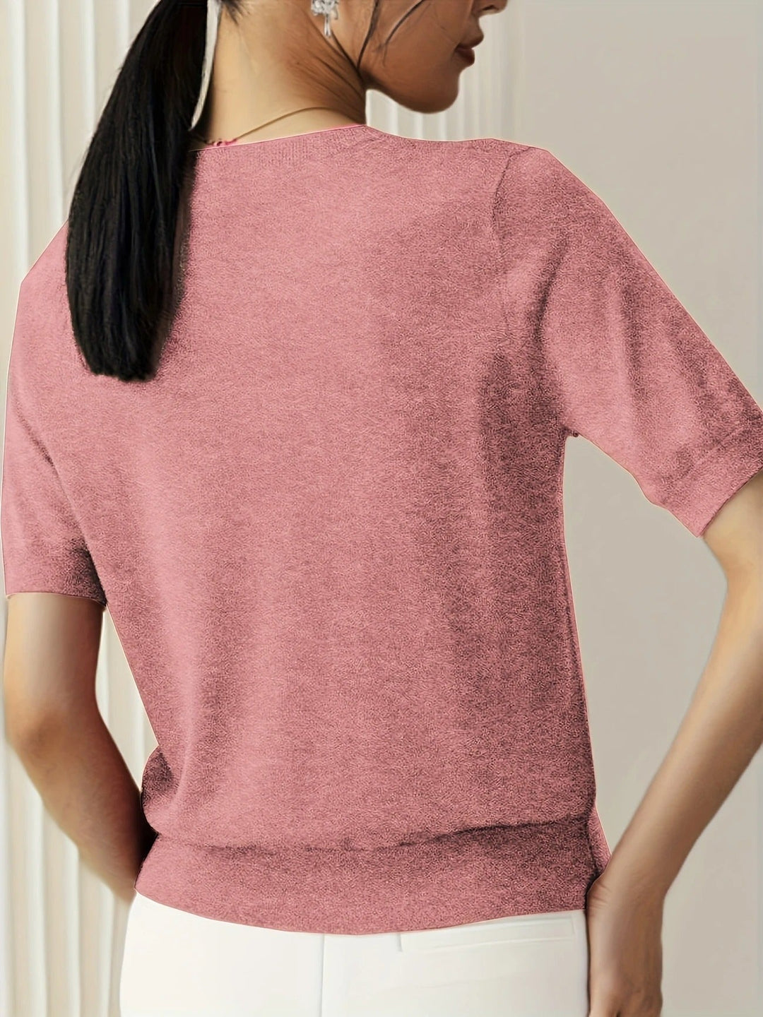 Relaxed women's short sleeve top. Crew neck with a distinctive ribbed hem.