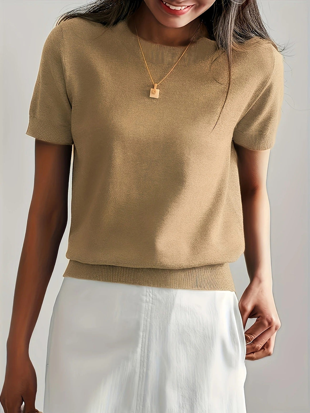 Everyday basic women's short sleeve crew neck tee. Comfortable ribbed hem.