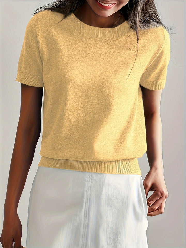 Go-to women's short sleeve top with a crew neck and a trendy ribbed hem.