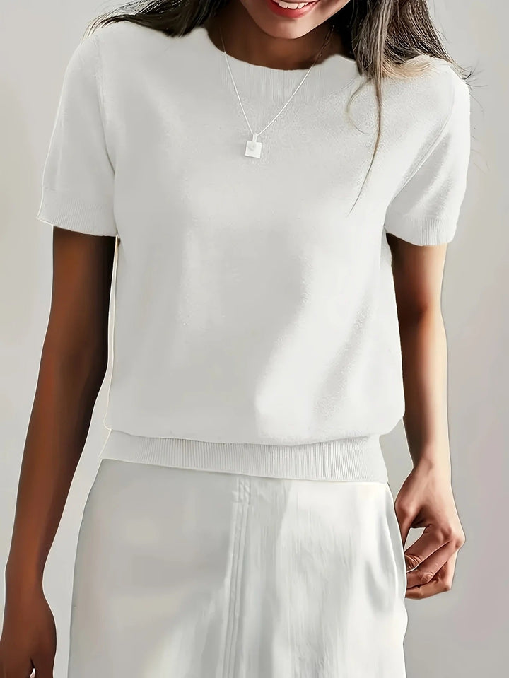 Contemporary women's crew neck short sleeve tee with a modern ribbed hem.