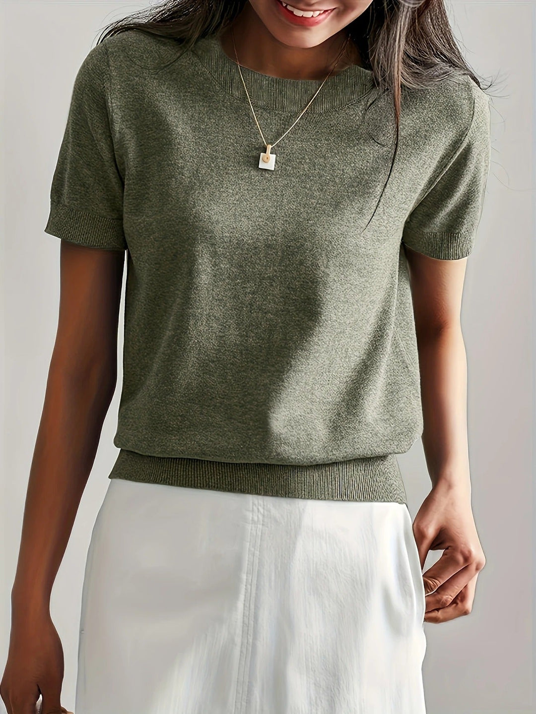Versatile women's crew neck top. Short sleeve with a chic ribbed hem for everyday.