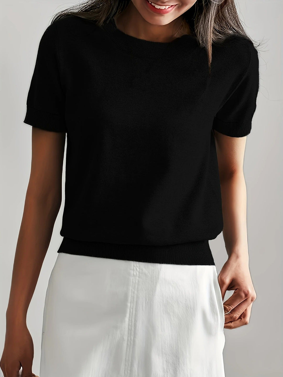 Everyday wear women's crew neck short sleeve top. Ribbed hem detail.