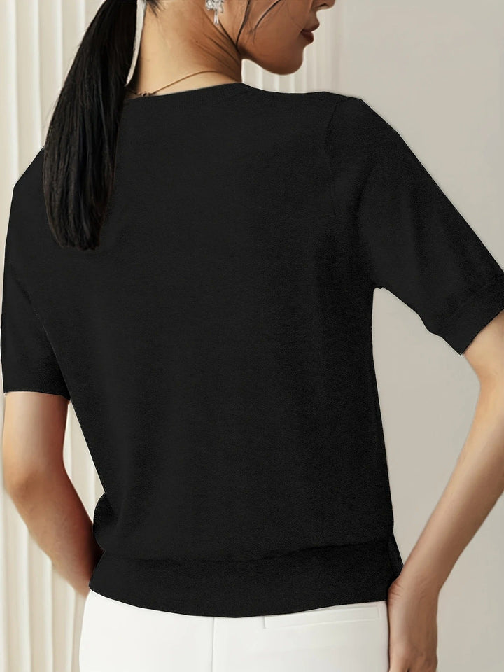 Women's short sleeve tee, crew neck design, and stylish ribbed hem.