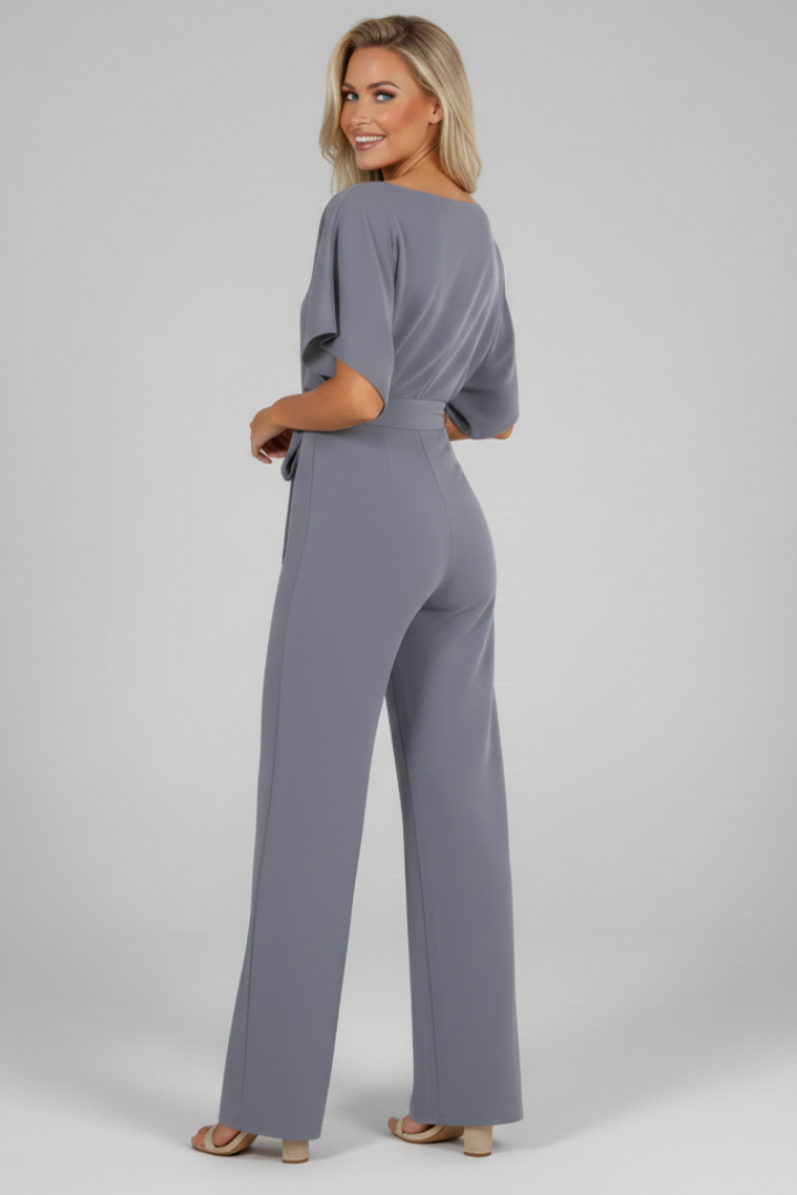 Black short sleeve jumpsuit for women featuring a chic waist tie, ideal for modern, comfortable fashion.