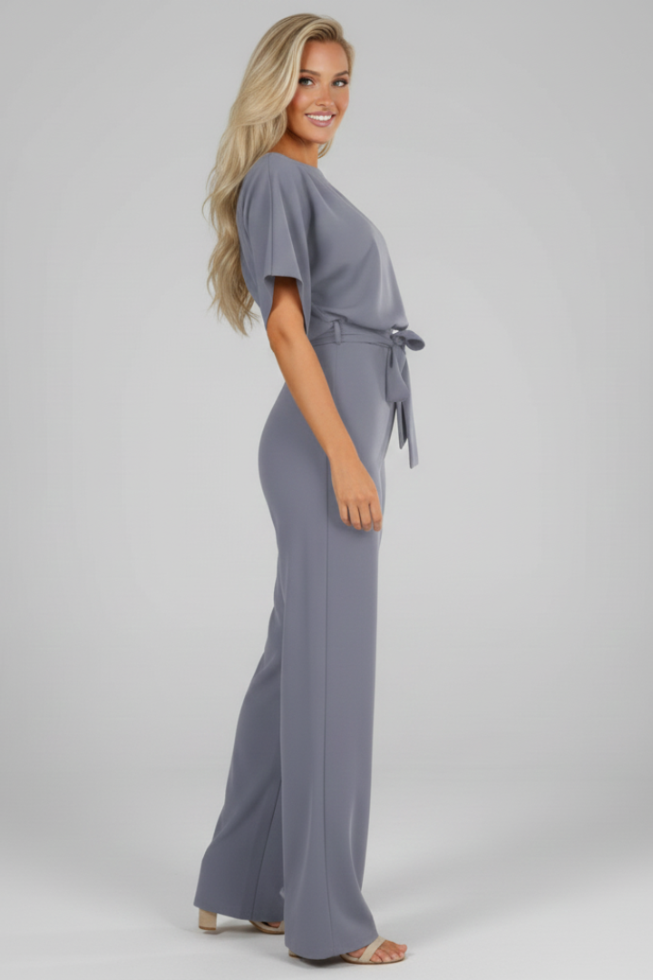 Apricot women's short sleeve jumpsuit with a stylish waist tie, offering a fresh, versatile look.