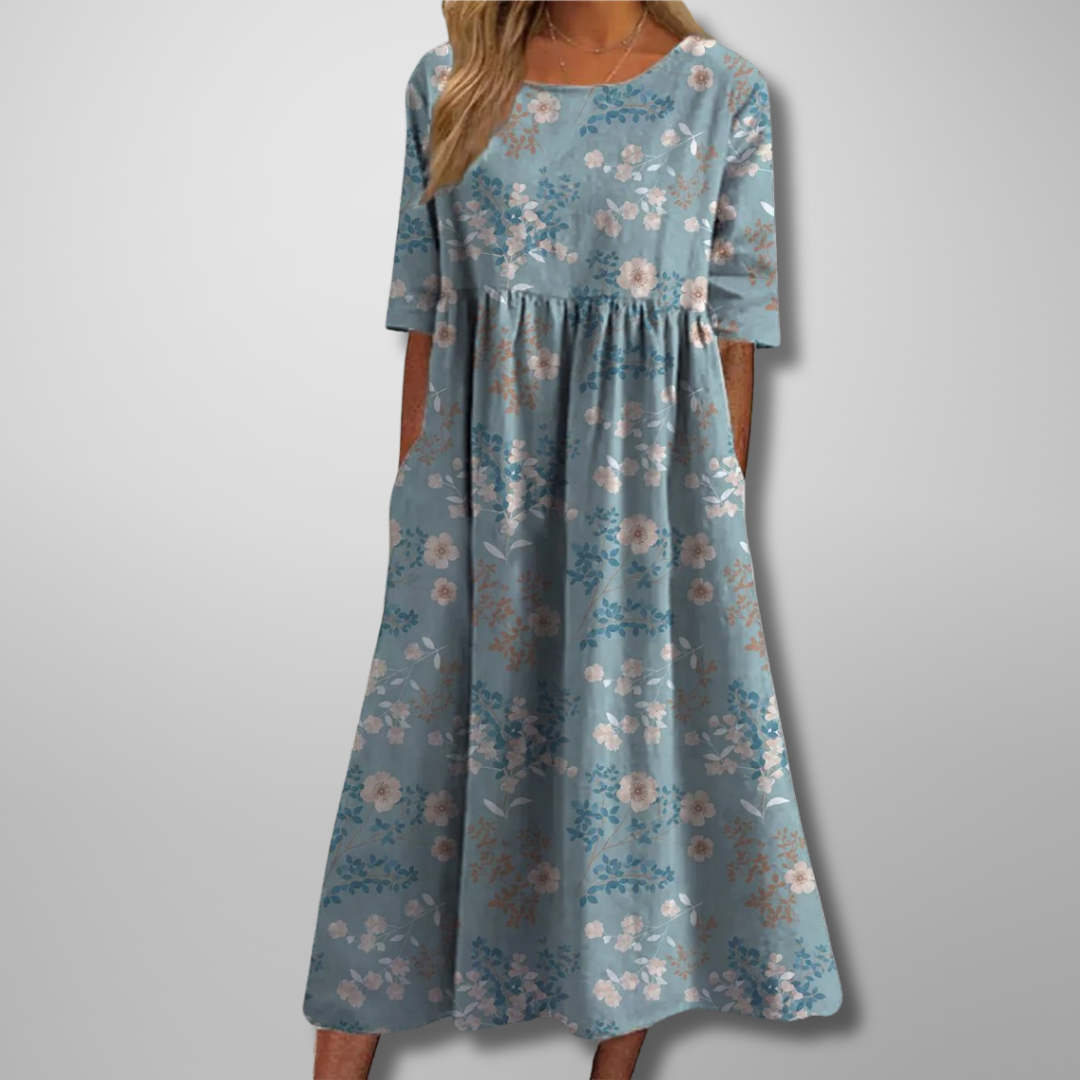 Women's printed short sleeve midi dress with a flowy loose fit, round neck, and stylish botanical pattern.