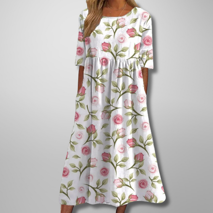 Chic women's loose fit short sleeve midi dress, featuring a botanical print for comfortable summer style.