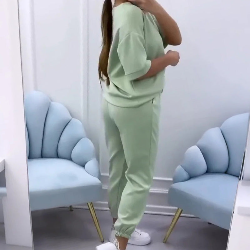 Chic women's relaxed fit short sleeve set, versatile two-piece apparel for comfortable summer fashion.