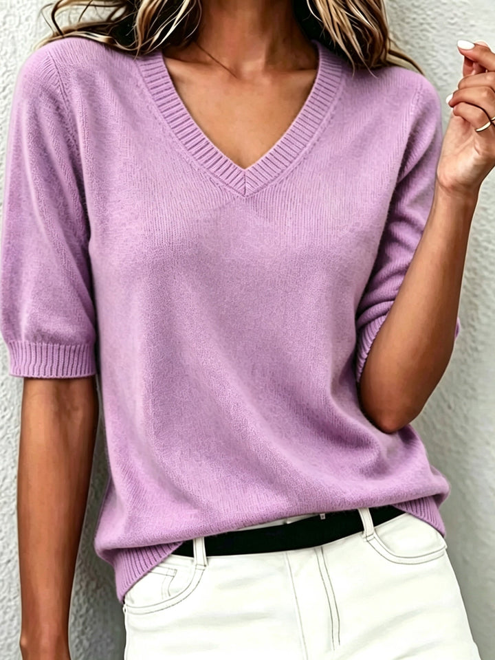 Women's short sleeve V-neck sweater with ribbed collar, versatile for smart casual & office.
