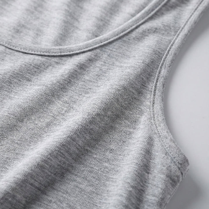 Women's round neck sleeveless activewear top, versatile for gym, yoga or casual fitness.