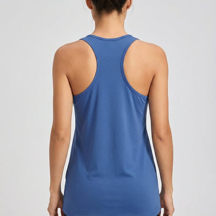 Performance sleeveless women's sports top, designed for ultimate comfort & movement in active settings.