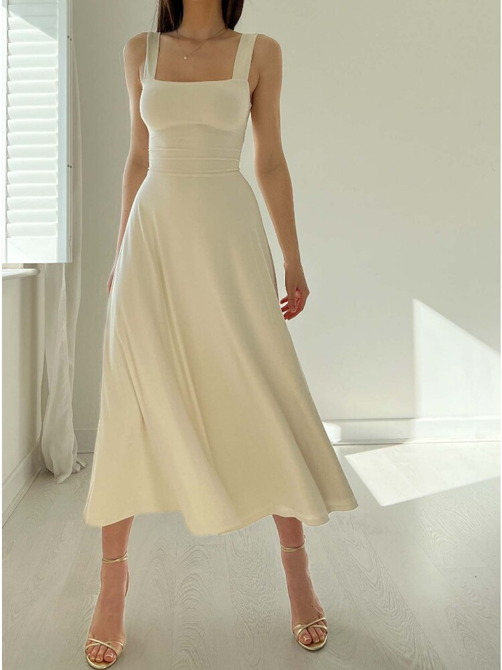 Versatile sleeveless A-line midi dress for women. Ideal for casual outings or an elegant formal look.