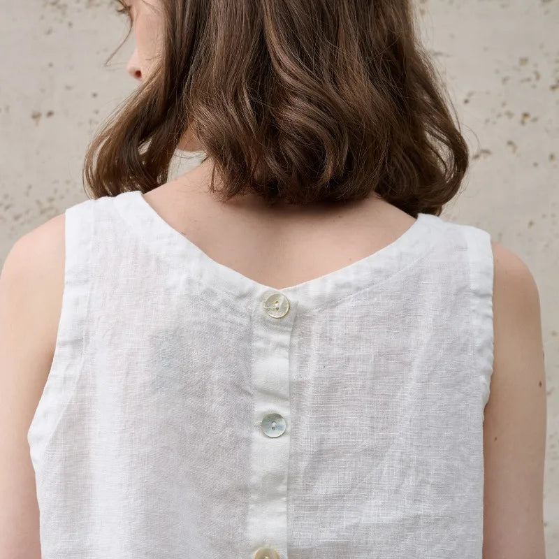 Versatile women's sleeveless crop top, asymmetric design & crew neck. Chic for trendy daily outfits.