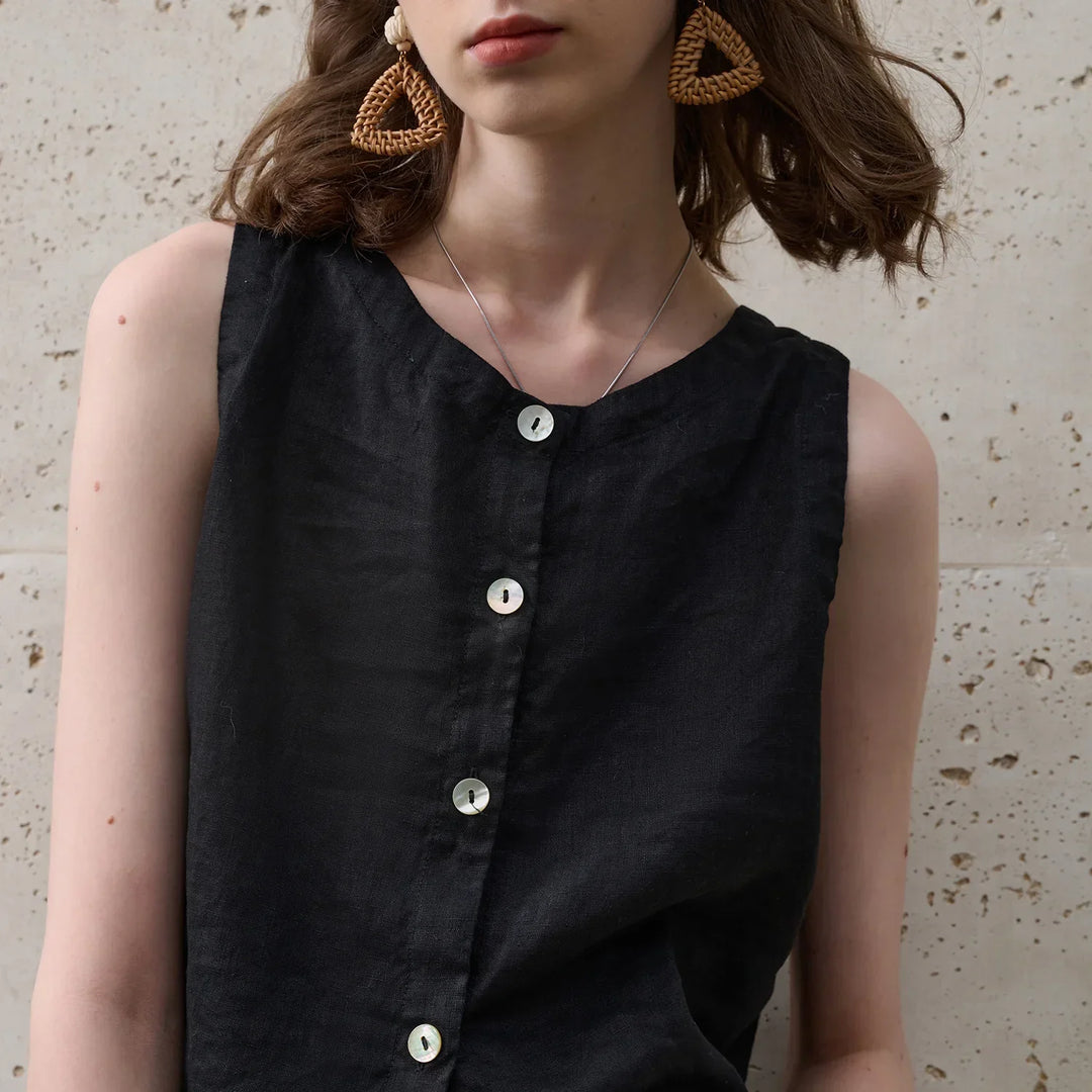 Stylish women's asymmetric crop top, sleeveless with crew neck. Perfect for trendy summer vacation wear.