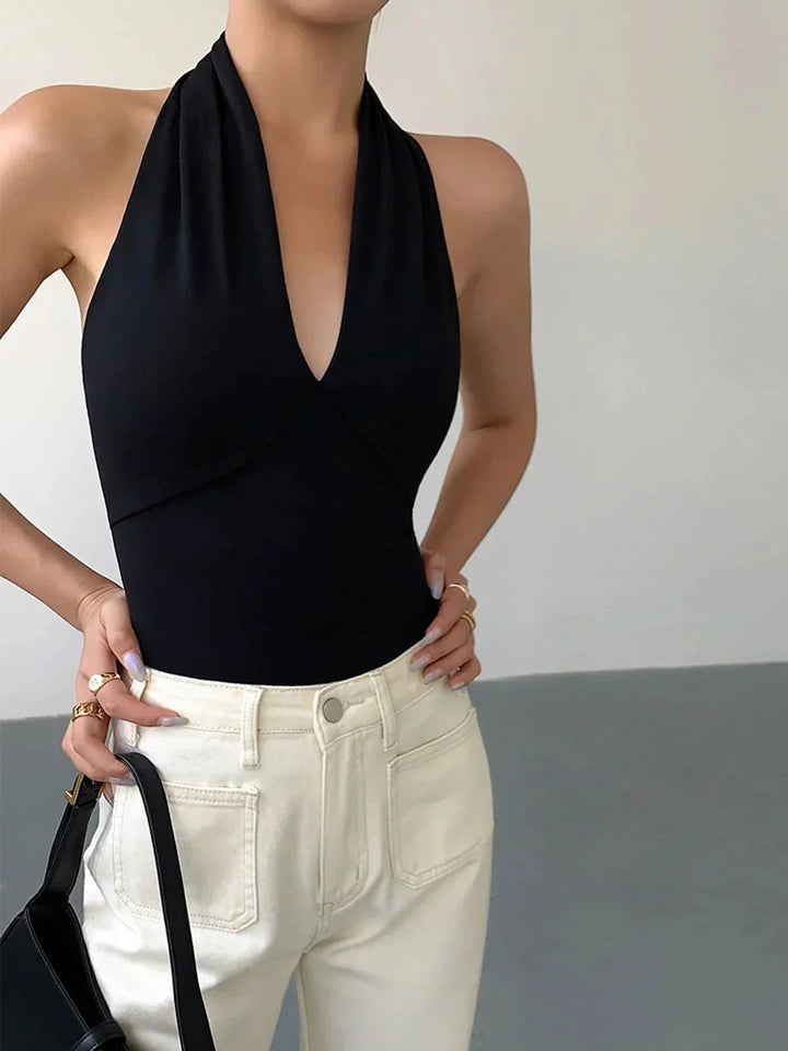 Women's sleeveless halter top with crossover V-neck, ideal for casual daily wear & chic style.