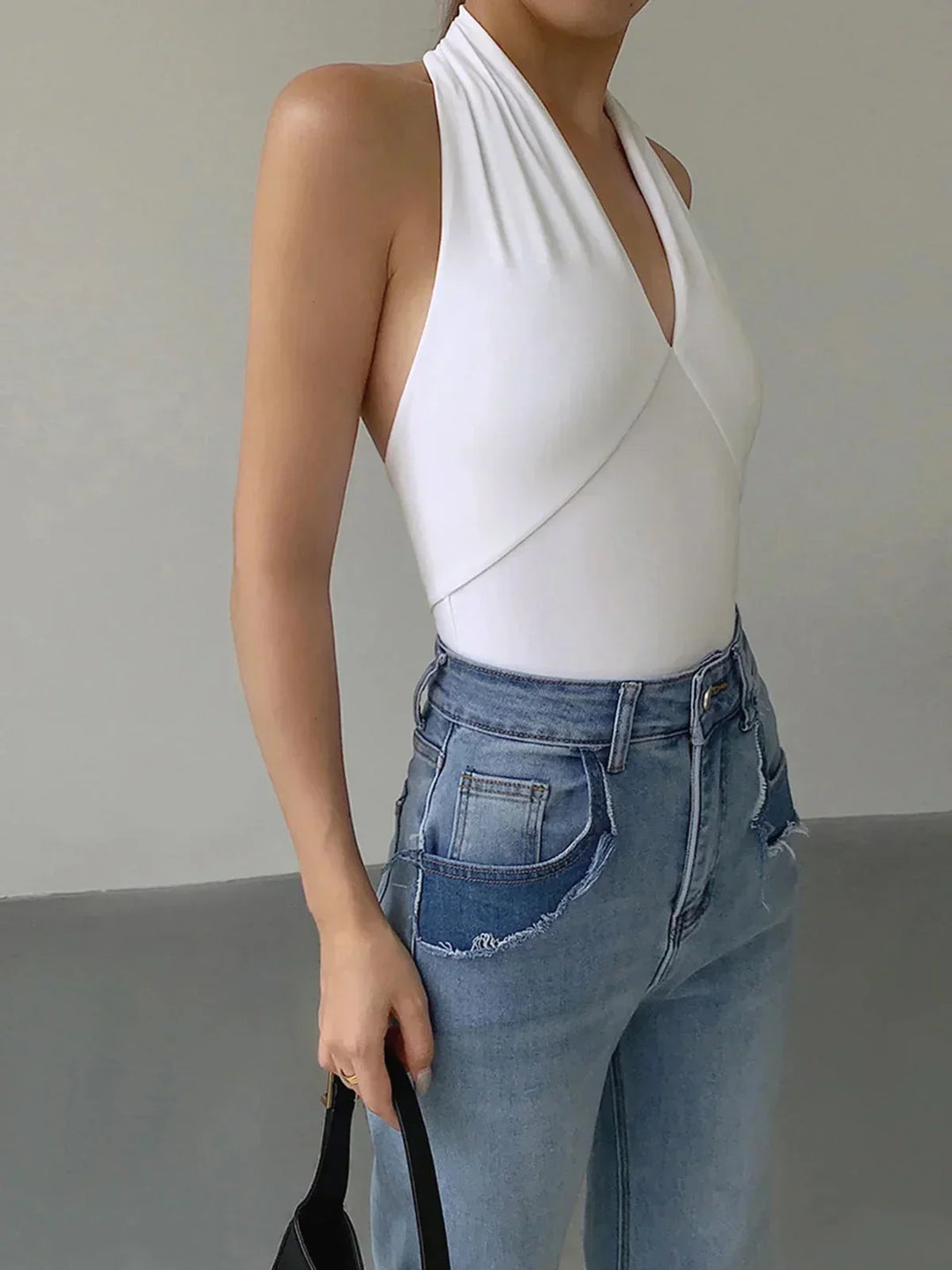 Women's sleeveless halter top, V-neck design for casual daily fashion & chic style.