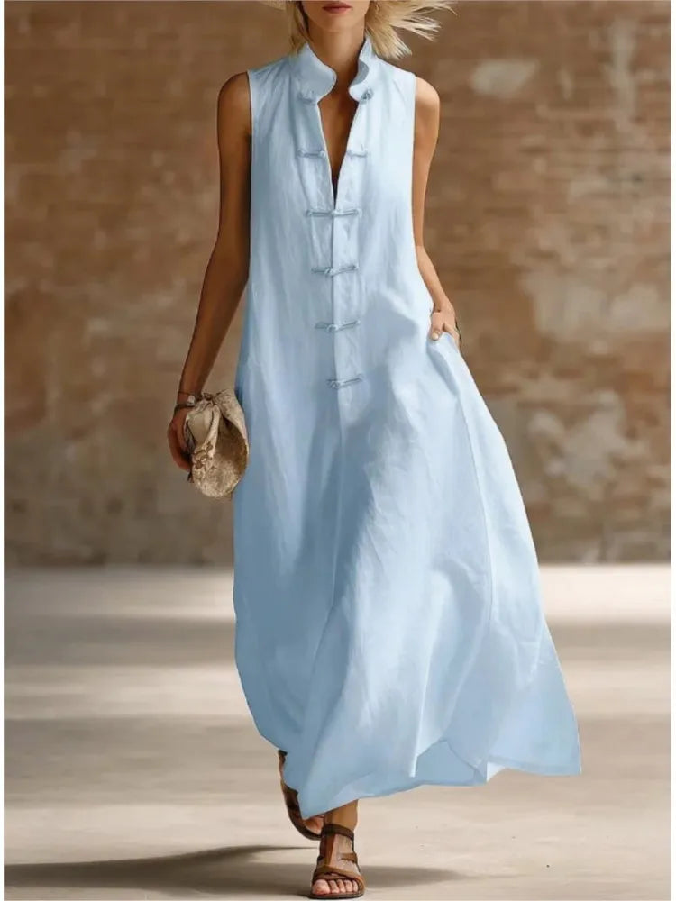 Women's sleeveless maxi shirt dress, perfect for casual summer days or elegant resort wear. Collared and flowy.