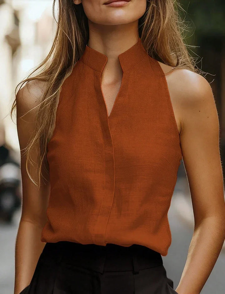 Women's sleeveless mock neck blouse, relaxed fit, perfect for chic spring & summer fashion.