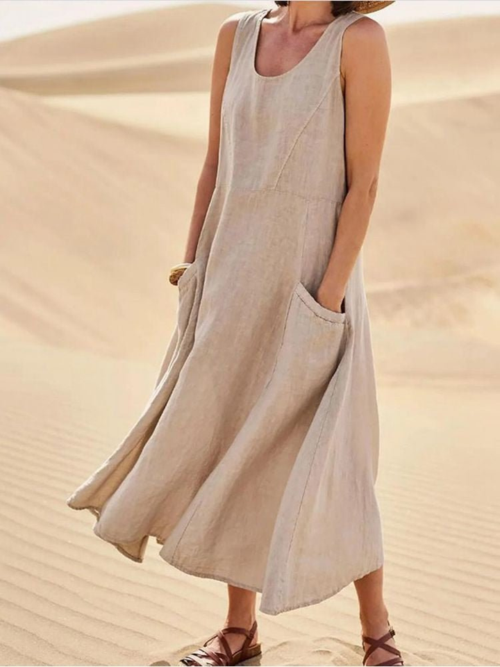 Women's sleeveless scoop-neck midi dress with pockets. Effortless, comfortable, and perfect for everyday wear.
