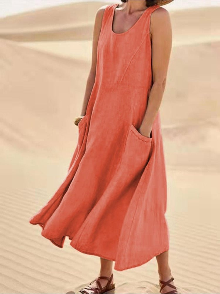 Comfortable women's sleeveless midi dress with scoop neck & pockets. Relaxed fit for effortless everyday style.