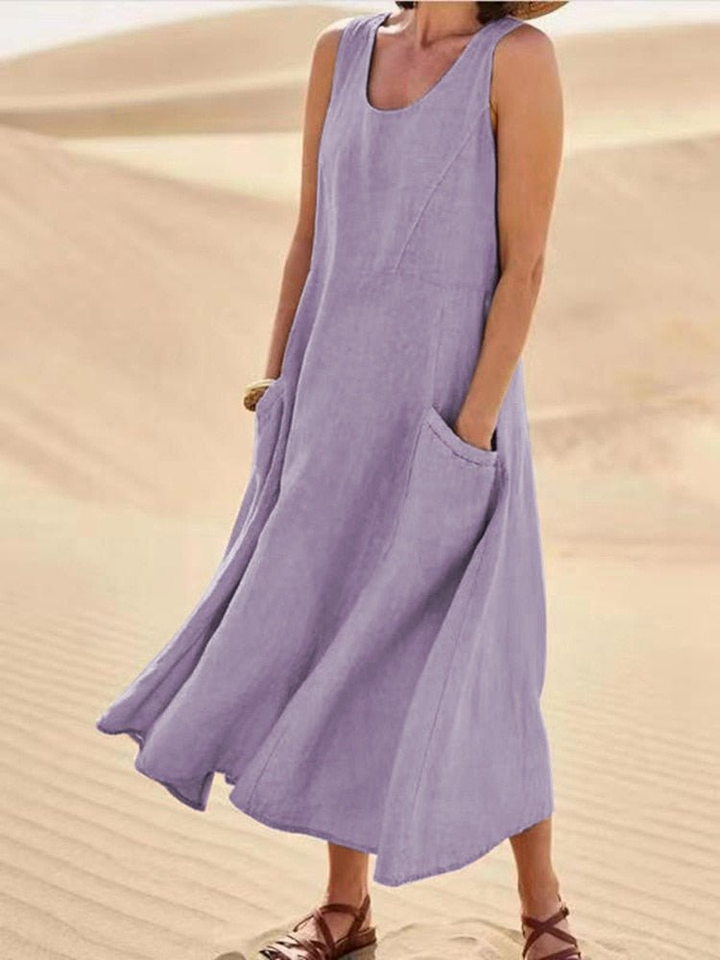 Chic sleeveless scoop-neck midi dress for women, featuring practical pockets. Great for beach outfits & summer.
