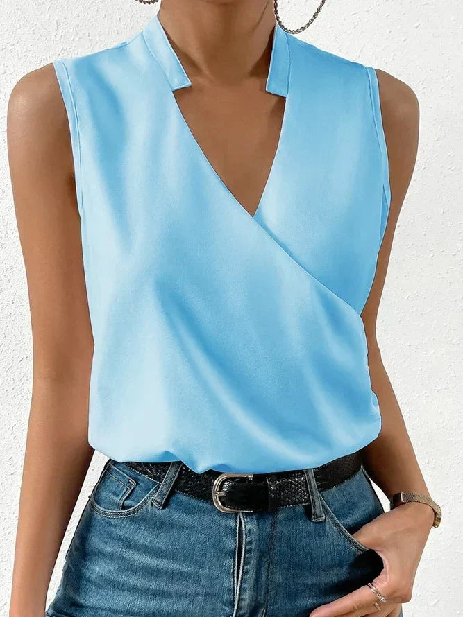 Stylish women's sleeveless wrap V-neck top, ideal for summer fashion. Elegant relaxed fit ladies wear.