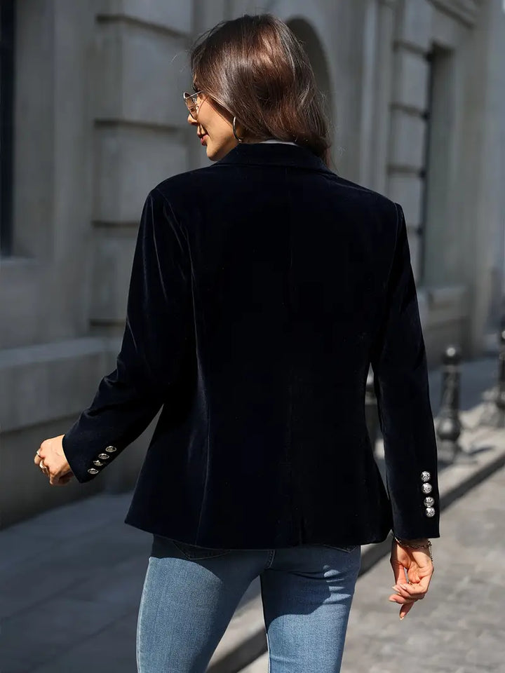 Structured women's blazer, slim fit, with shimmering gold buttons & a sharp peak lapel, versatile.
