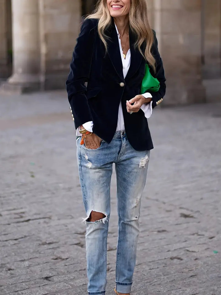 Tailored women's slim fit blazer, featuring luxurious gold buttons and a classic peak lapel.