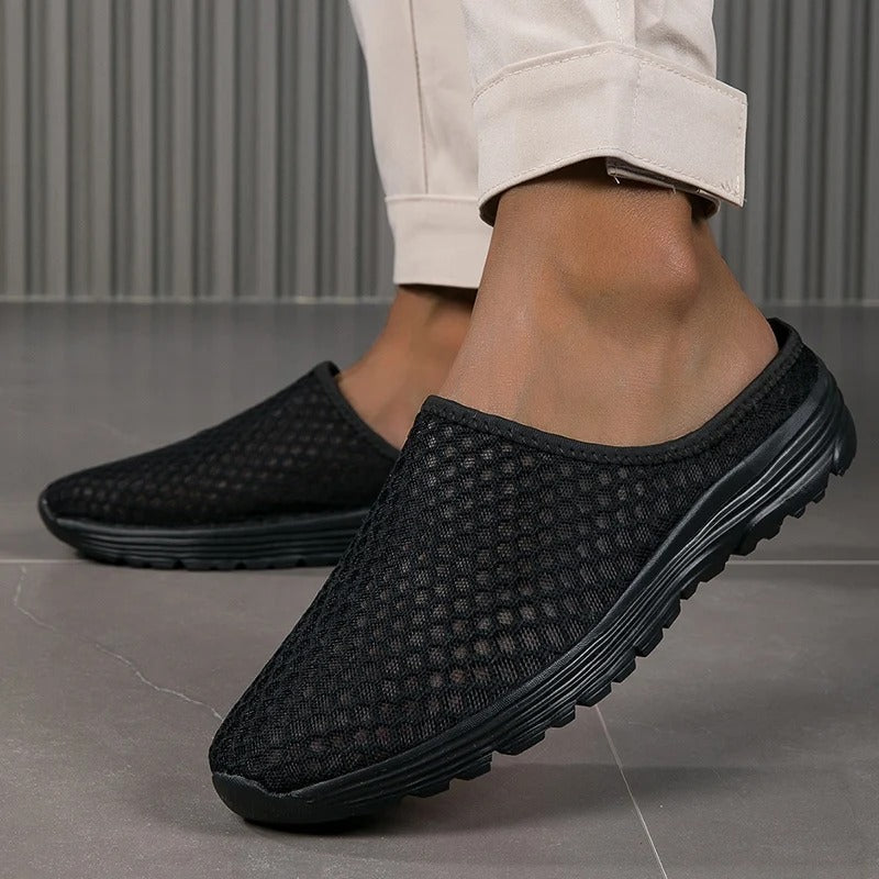Breathable mesh women's slip-on sneakers, offering orthopedic arch support & cushioned comfort for walking.