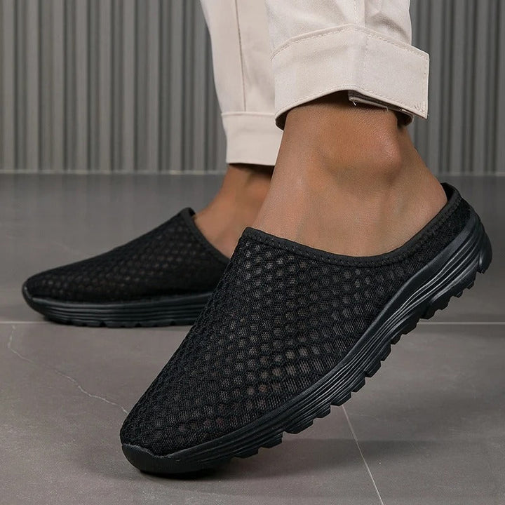 Breathable mesh women's slip-on sneakers, offering orthopedic arch support & cushioned comfort for walking.