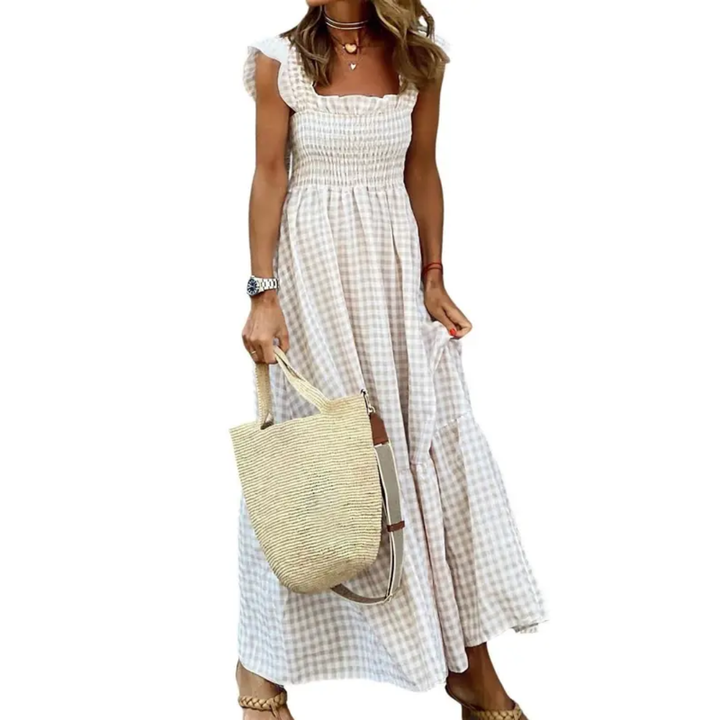 Women's smocked tiered maxi dress. Flowy summer style with comfortable fabric, perfect for casual elegance or vacation.